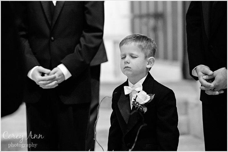 ring bearer praying during wedding ceremony in canton ohio