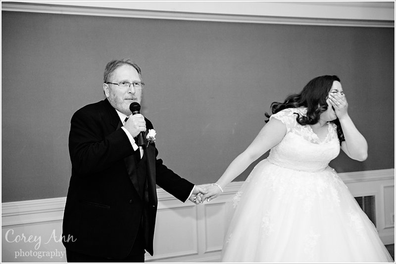 bride's father singing to her at wedding reception