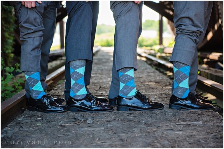 grey and teal argyle socks on groom and groomsman