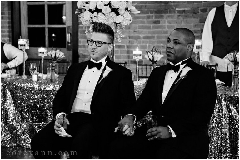 grooms listening to best man give wedding toast