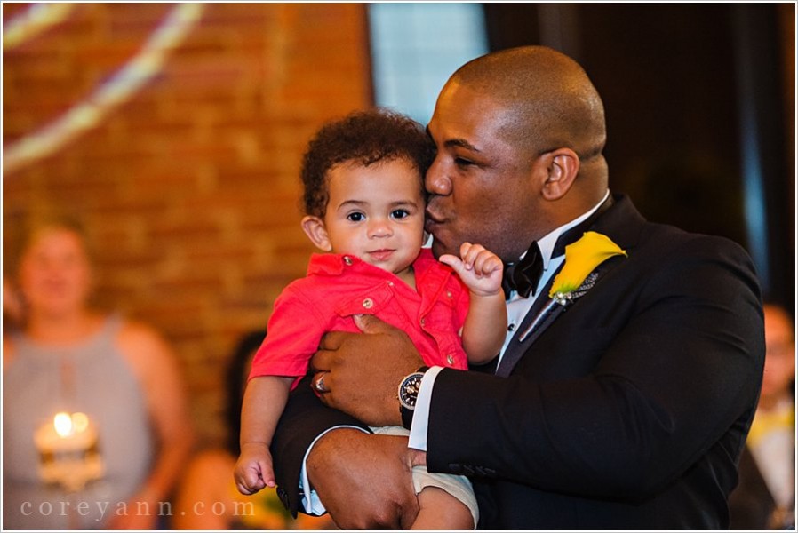 nephew having happy birthday sung to him at wedding reception