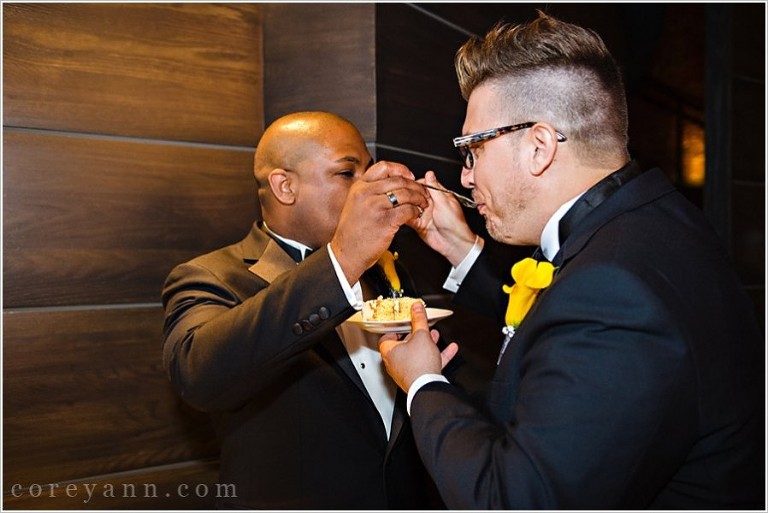 gay grooms cutting the wedding cake