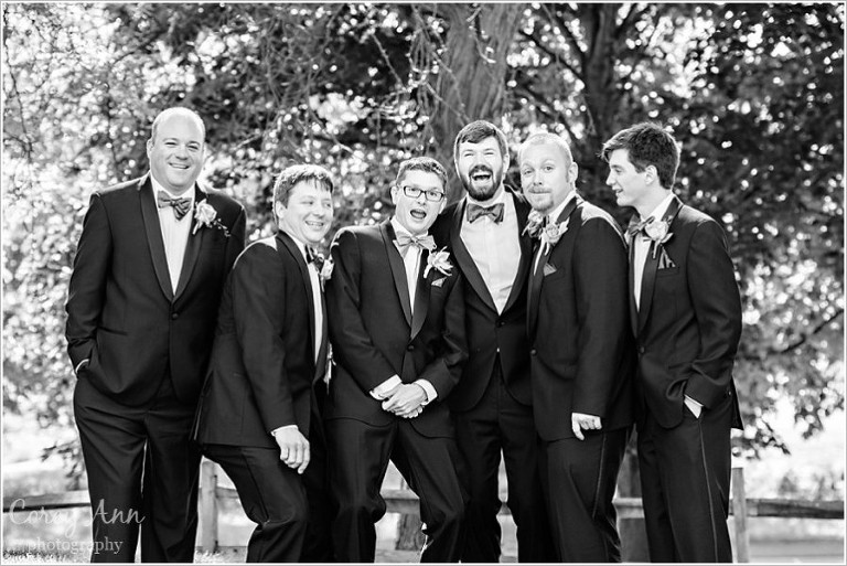 groomsman laughing during portraits after wedding ceremony in ohio