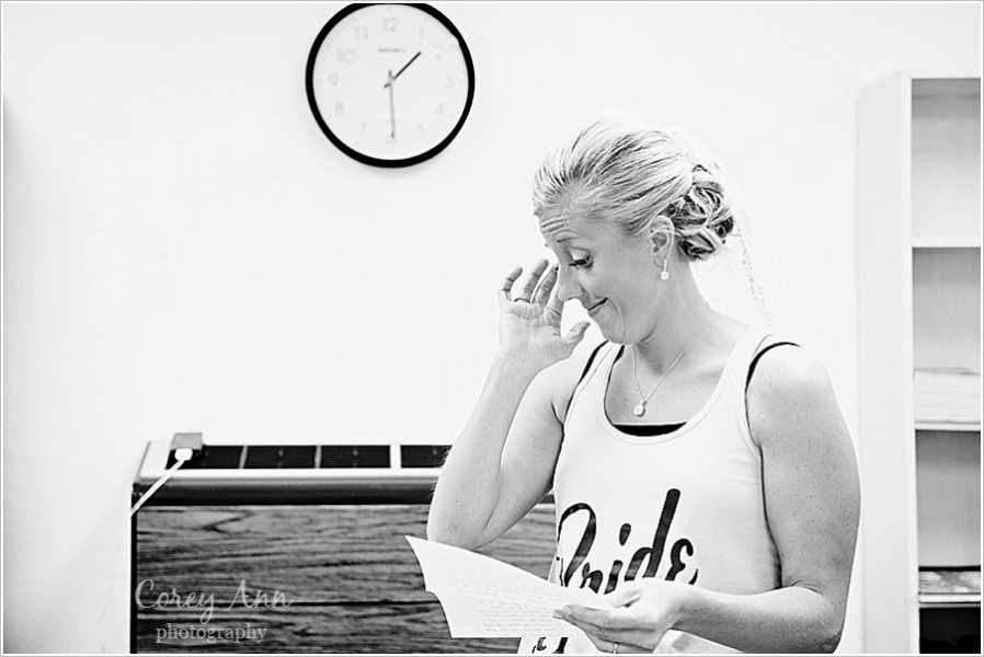 bride reading letter from groom before ceremony