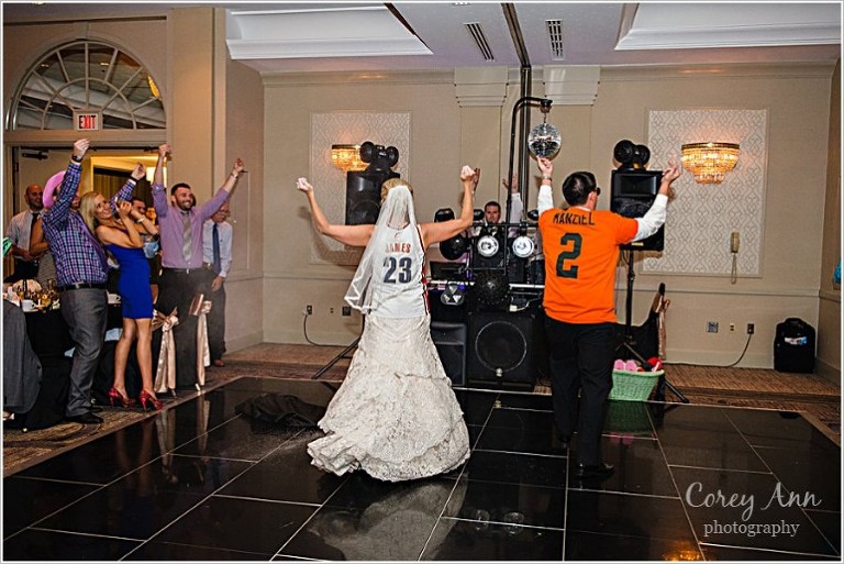 bride and groom entering wedding reception with lebron james jersey
