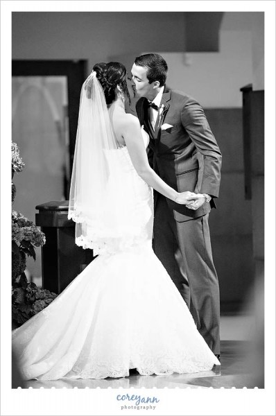 first kiss during wedding ceremony at blessed sacrament parish in warren ohio
