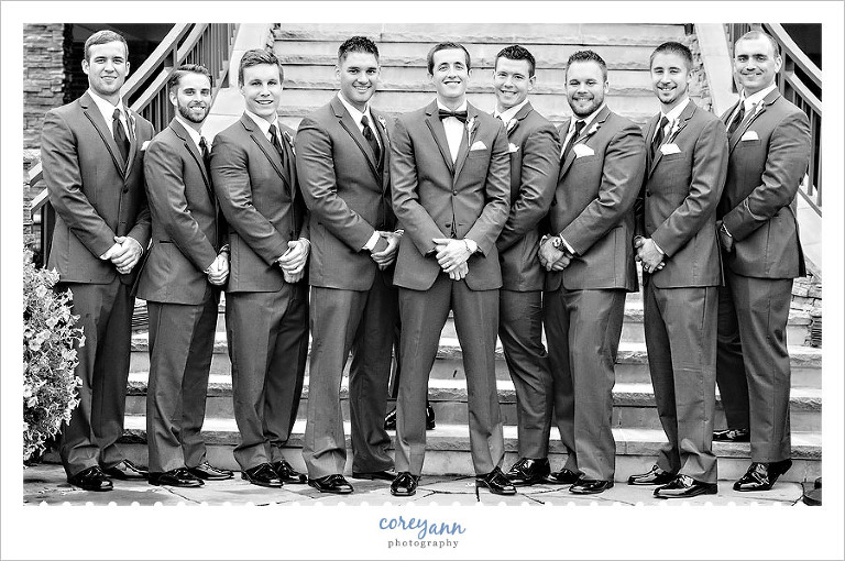 groomsman on stairs at the lake club in poland ohio