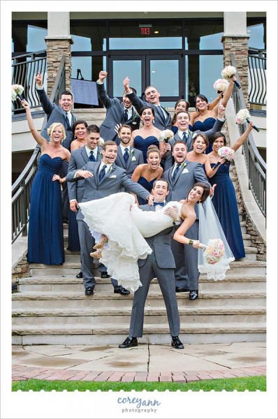pink and blue bridal party on stairs