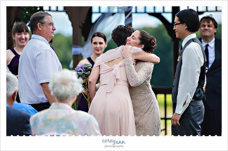 bride hugging her mom after wedding ceremony in ohio