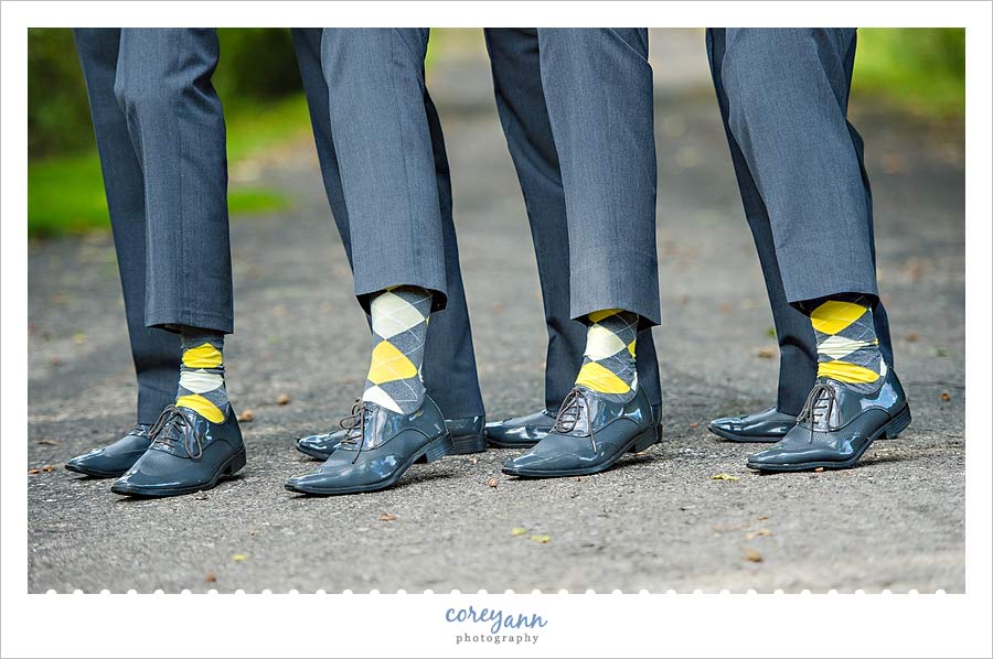 groomsman wearing grey and yellow argyle socks