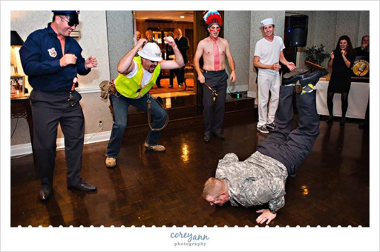 groomsman doing the worm at wedding reception at fairlawn country club