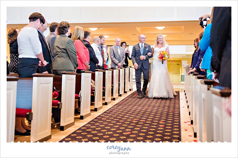 bride being escorted down the aisle with father in bath ohio