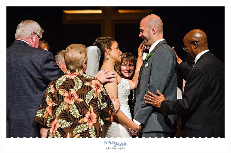 prayer circle during wedding ceremony
