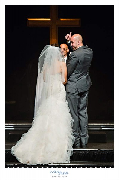 groom giving thumbs up during wedding ceremony in ohio