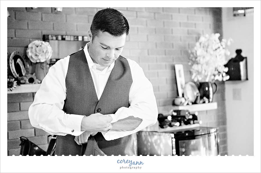 groom getting ready for wedding in ohio