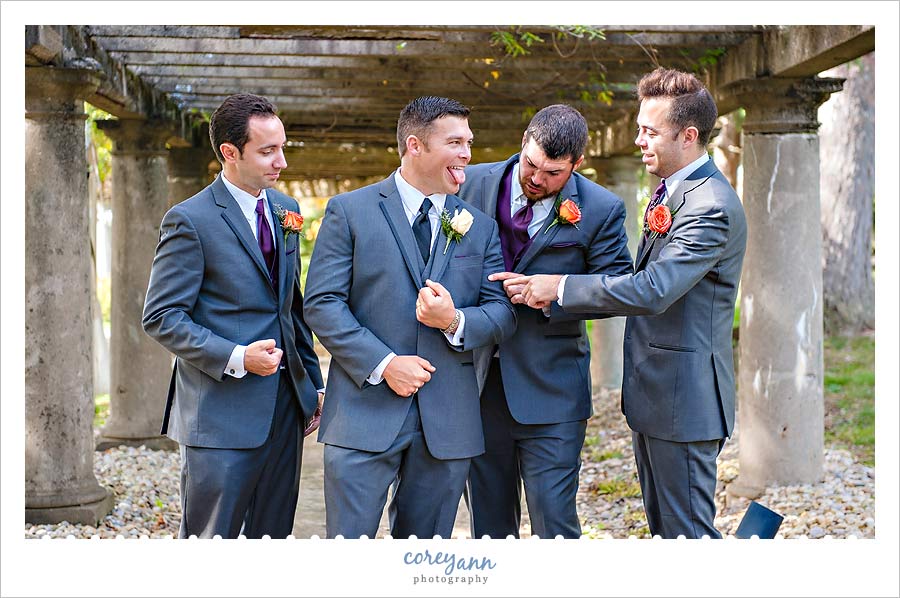 groomsman giving groom a hard time