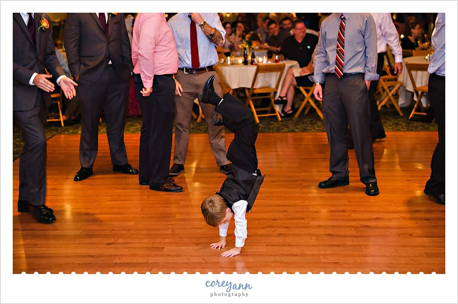 ring bearer dancing during wedding reception