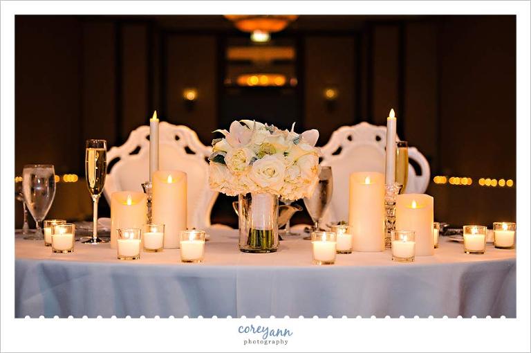 white chairs at sweethart table at cleveland marriott wedding reception