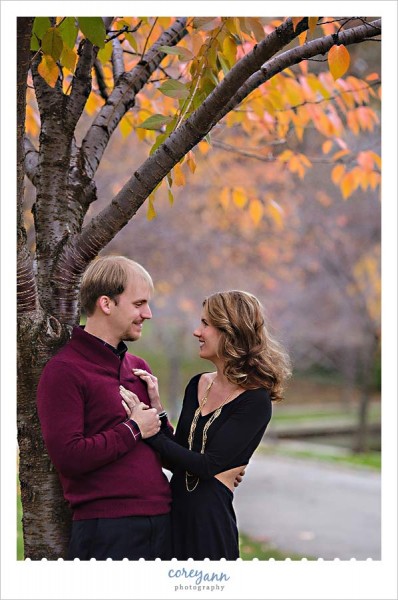 autumn engagement session with colorful leaves in ohio