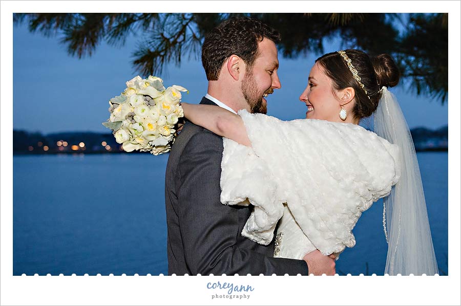 bride wearing fur shawl during wedding ceremony