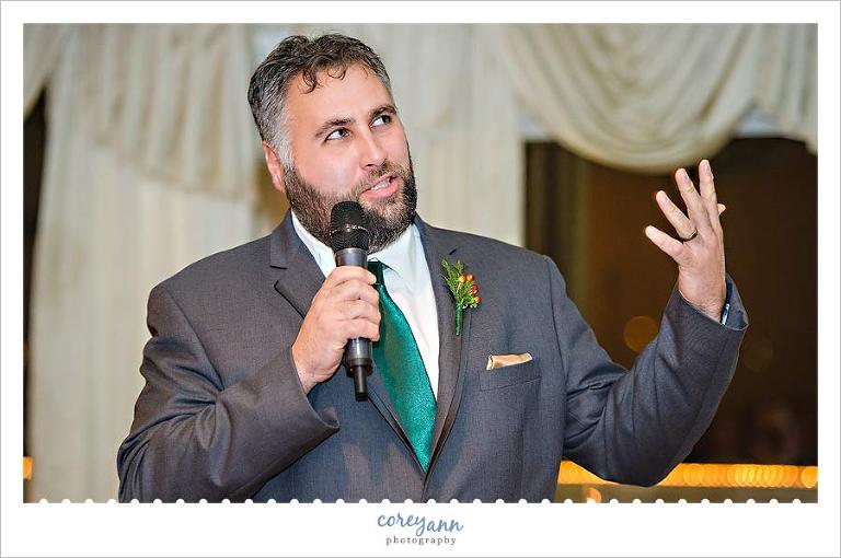 best man giving toast during wedding reception