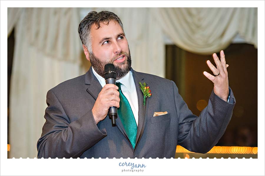 best man giving toast during wedding reception