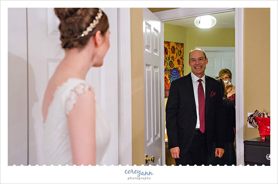 father of bride first look of bride in gown