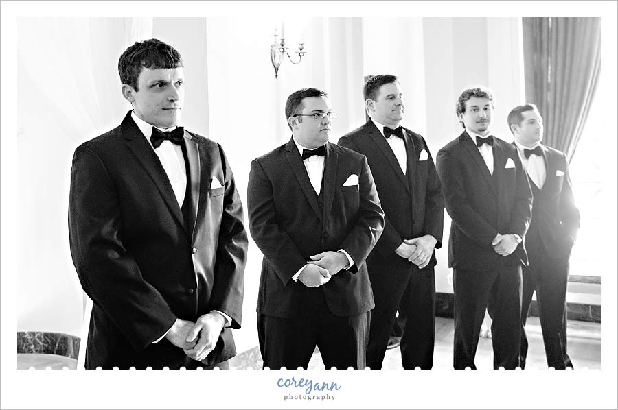 groom watching bride walk down the aisle