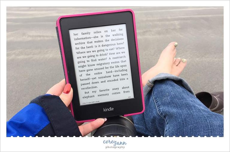 reading a kindle on the beach