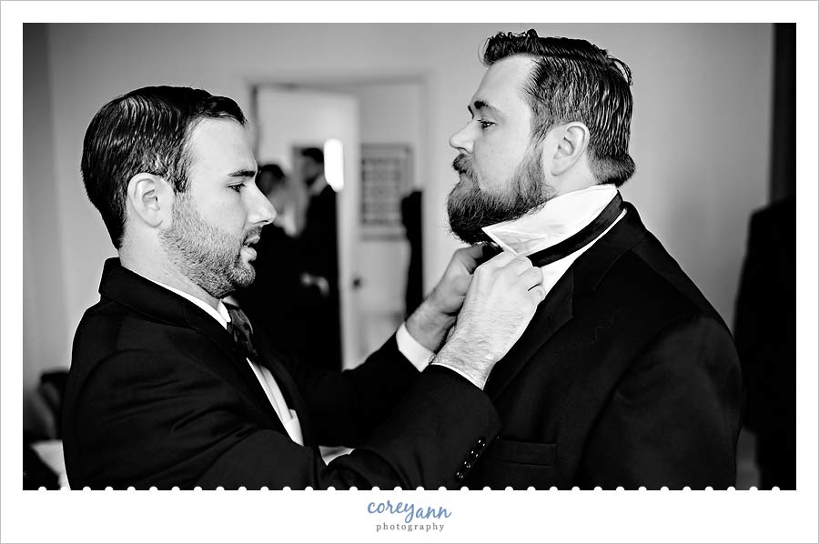 groomsman getting ready for wedding at the hyatt arcade in cleveland