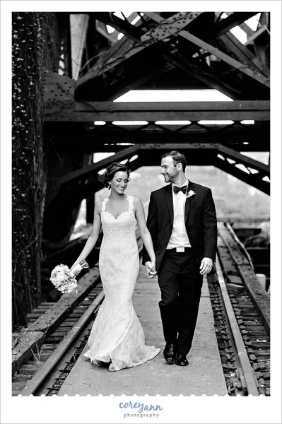 bride and groom walking inside bridge in downtown cleveland