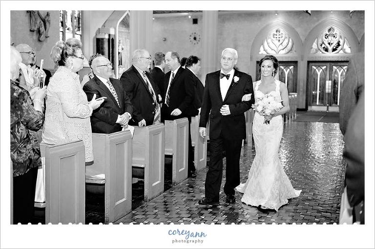 bride walking down the aisle at st johns in downtown cleveland