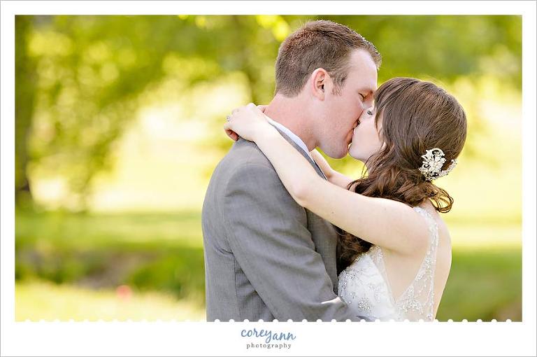 bride and groom kissing at brookside country club