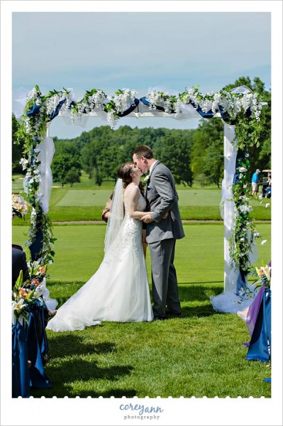 first kiss outdoor wedding ceremony