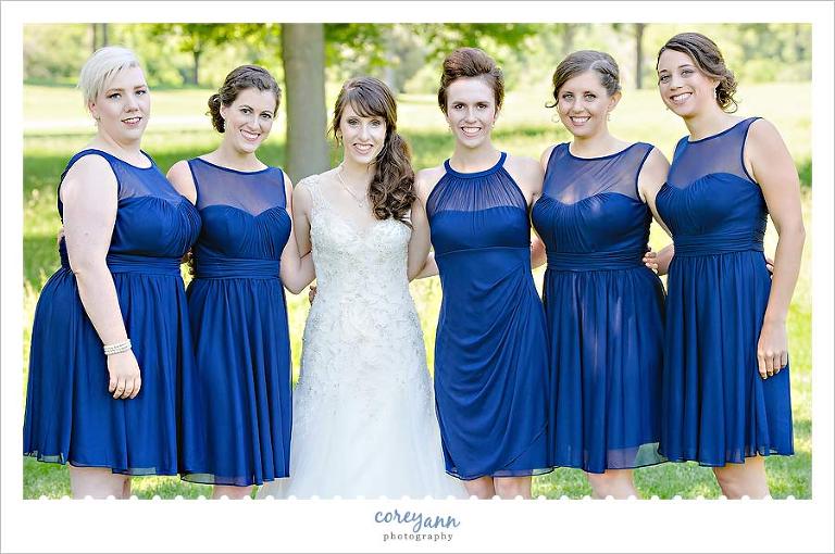 bride and bridesmaids in short blue dresses