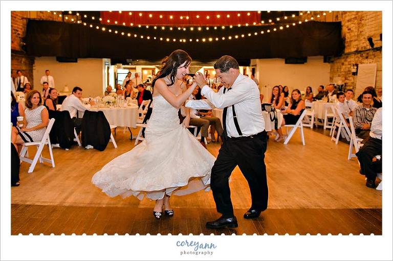 father daughter salsa dancing at wedding reception