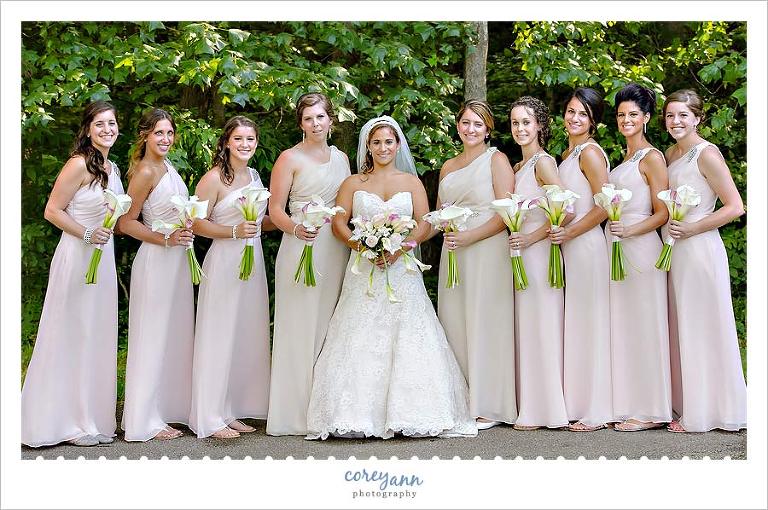 bridesmaids in long pink dresses with white and pink bouquets