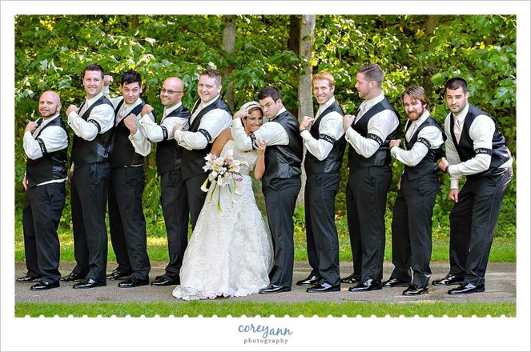 bride with groomsman with black arm band