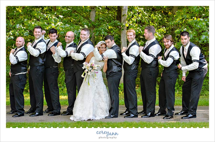 bride with groomsman with black arm band