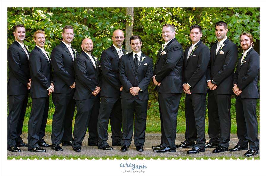 groomsman in black suits with black ties