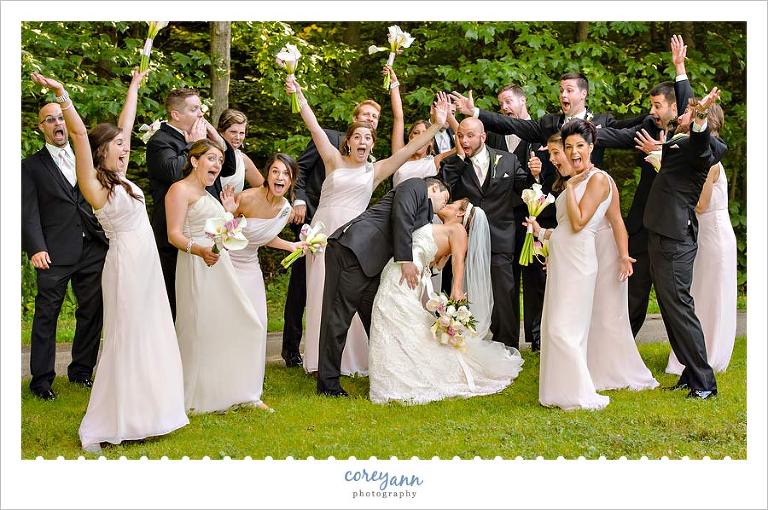 bridal party cheering for bride and groom at squires castle