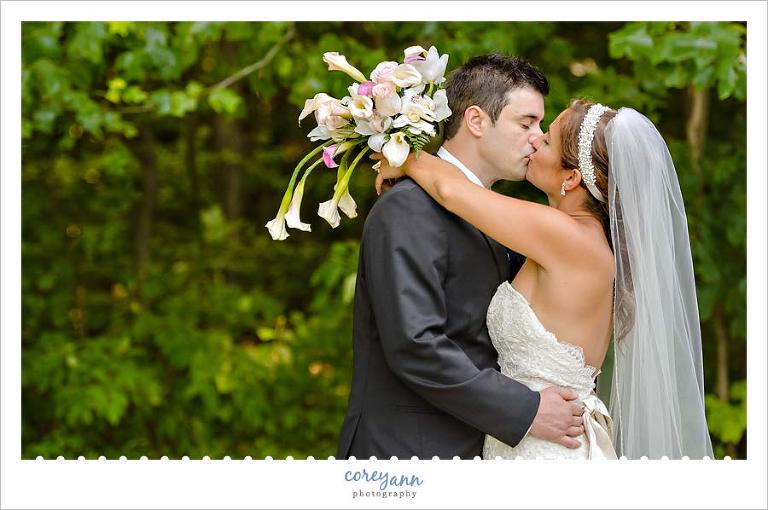 bride and groom kissing during pictures