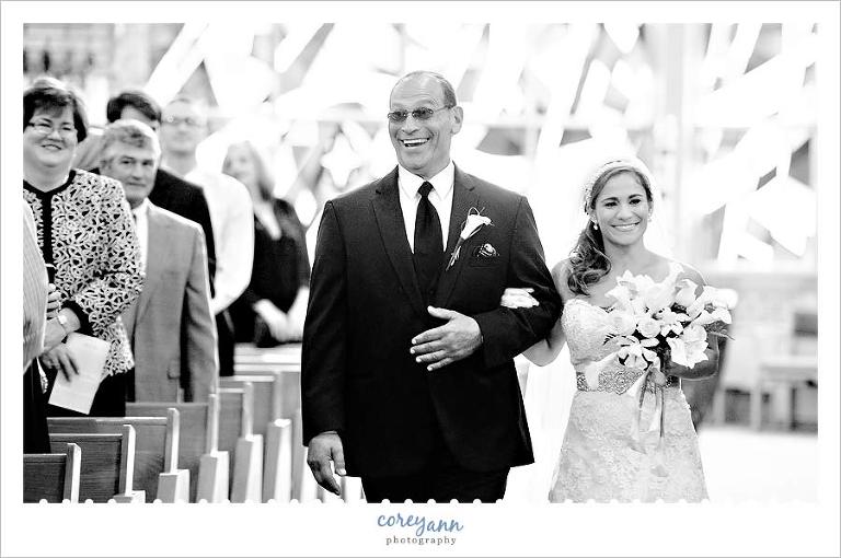 bride and beaming father walking down aisle at st basil the great