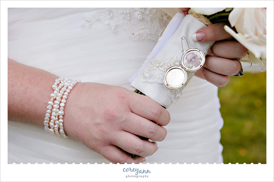 locket with grandparent picture on wedding bouquet