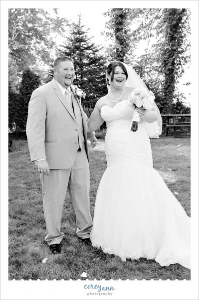 bride and groom laughing during portraits