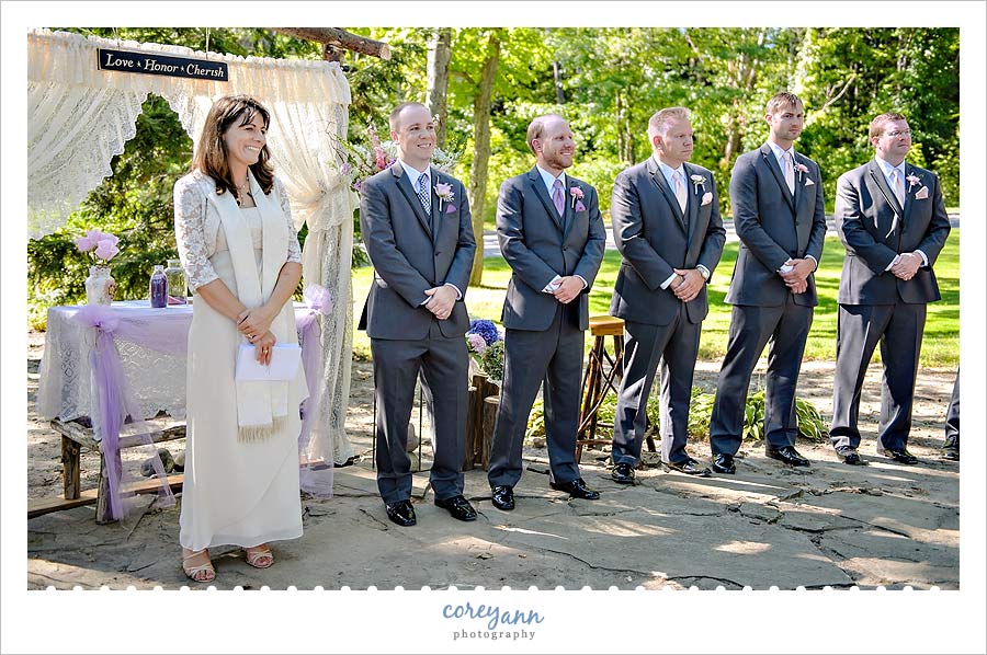 groom watching bride coming down the aisle in chagrin falls wedding