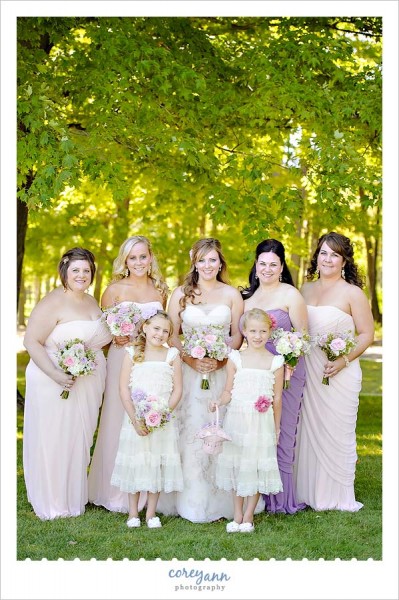 bridesmaids with long pink and purple gowns 