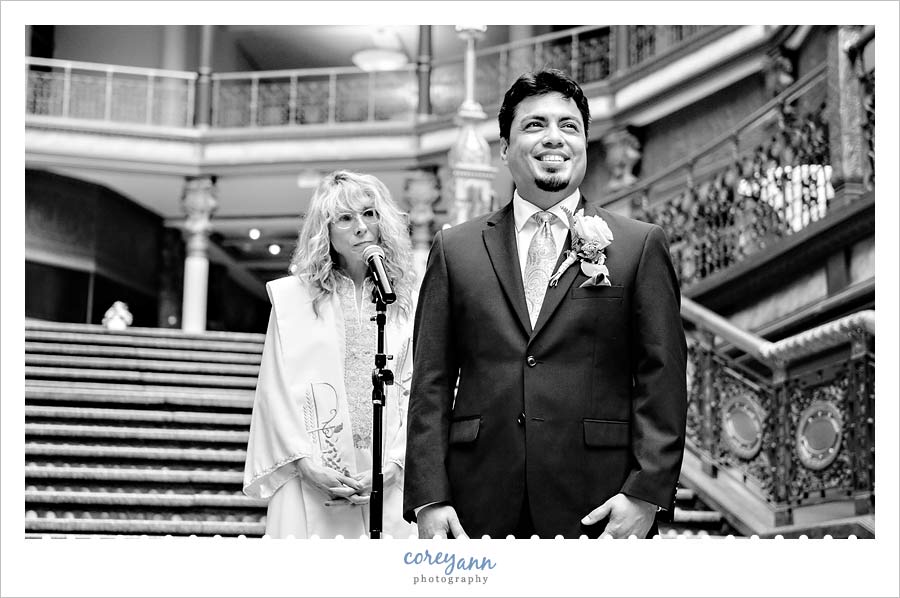 groom seeing bride as she's coming down the aisle