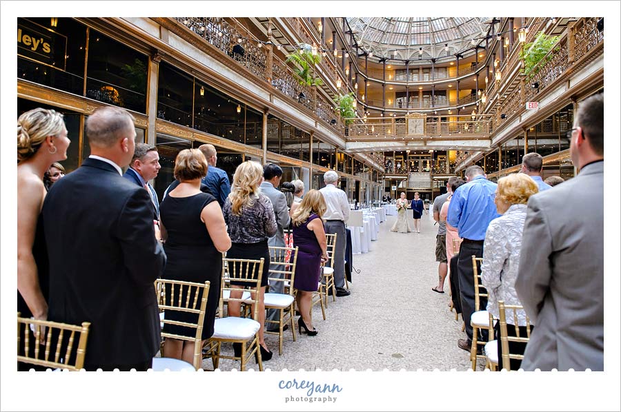 bride walking down the aisle at the hyatt arcade