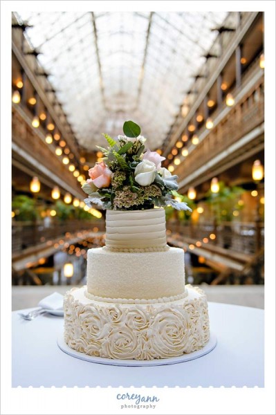 wild flour bakery cake in gold and ivory